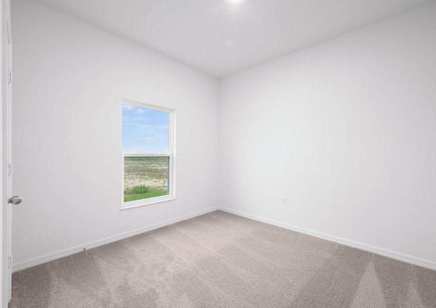 The secondary bedroom includes lush carpeting The secondary bedroom includes lush carpeting