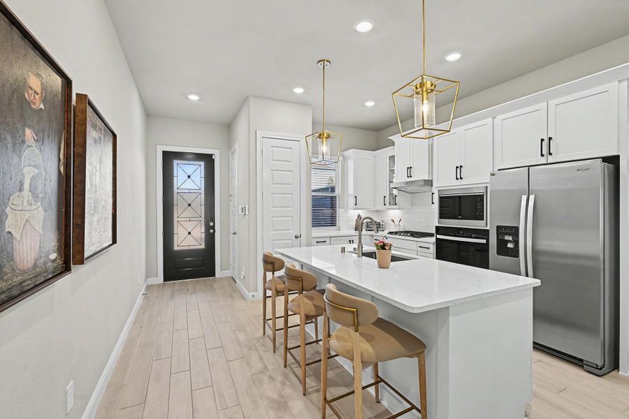 The breakfast bar offers the perfect spot for morning coffee, casual meals, or entertaining. The breakfast bar offers the perfect spot for morning coffee, casual meals, or entertaining.