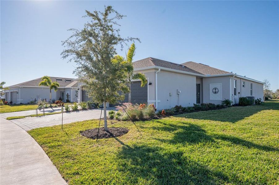 Front exterior of a new home in , Englewood, FL, highlighting curb appeal (Image 18).