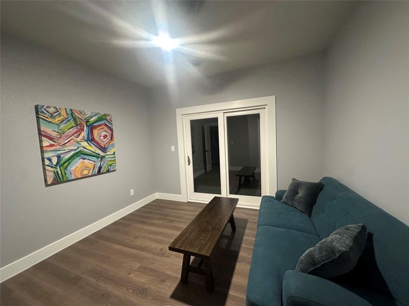 Bedroom on main level with covered porch and lake views Bedroom on main level with covered porch and lake views