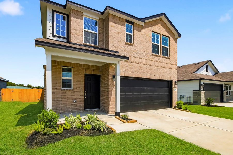 Front exterior of a new home in The Villages at Westpointe, Dayton, TX, highlighting curb appeal (Image 2). Front exterior of a new home in The Villages at Westpointe, Dayton, TX, highlighting curb appeal (Image 2).