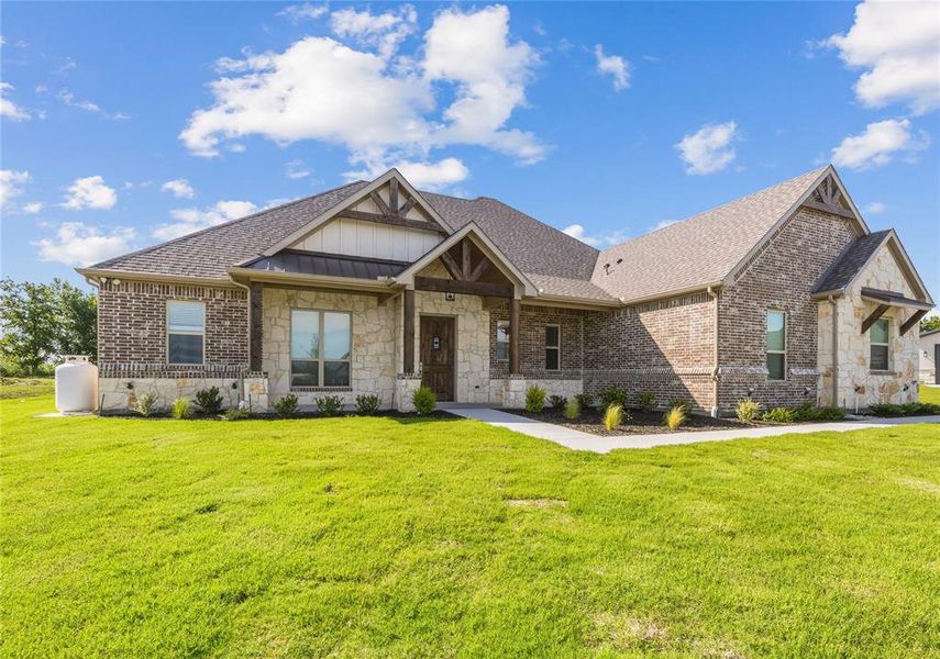 Front exterior of a new home in , Godley, TX, highlighting curb appeal (Image 18). Front exterior of a new home in , Godley, TX, highlighting curb appeal (Image 18).