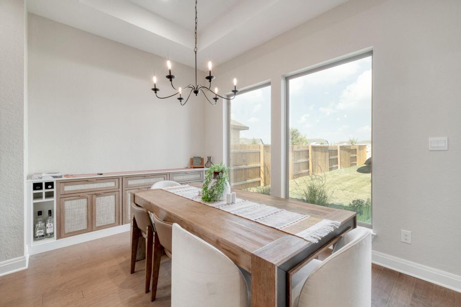 Built-in storage gives the dining area a stylish home for serving pieces or an adult bar.
