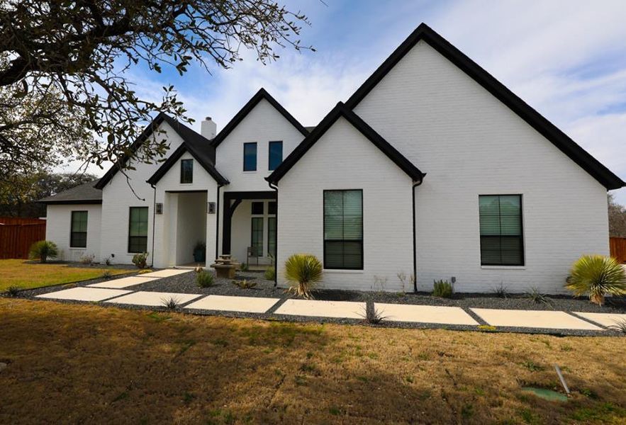 Representative exterior photo of a completed home built from the 178-3160-1217 by Abba River Homes in Stanford Estates, Springtown, TX (Image 1). Representative exterior photo of a completed home built from the 178-3160-1217 by Abba River Homes in Stanford Estates, Springtown, TX (Image 1).