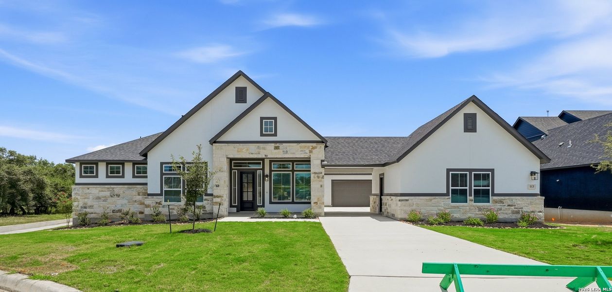 Front exterior of a new home in , Castroville, TX, highlighting curb appeal (Image 27).