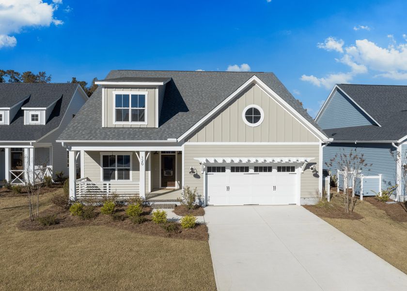 Front exterior of a new home in Riverside Cove, Wilmington, NC, highlighting curb appeal (Image 1).