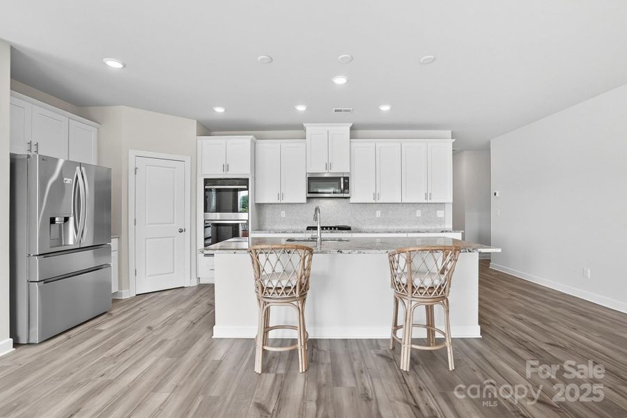 Furnished interior view inside a new home in Solena at the Vineyards II, Charlotte (Image 7). Furnished interior view inside a new home in Solena at the Vineyards II, Charlotte (Image 7).