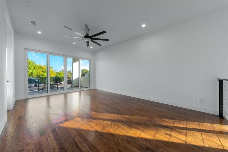 Game room with finished red oak wood floors, recessed lighting, and a ceiling fan. Game room with finished red oak wood floors, recessed lighting, and a ceiling fan.