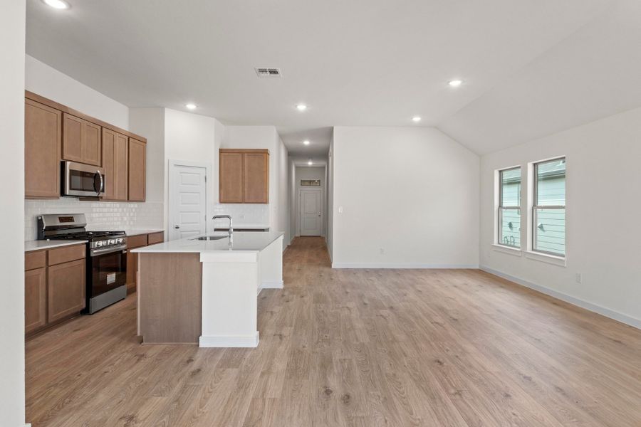 Kitchen in the Quartz home plan by Trophy Signature Homes – REPRESENTATIVE PHOTO