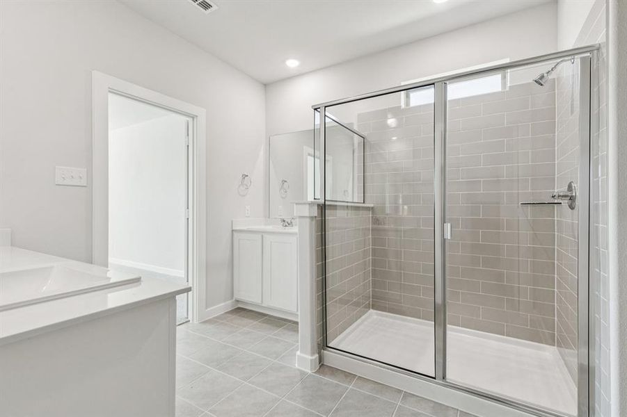 Primary Bathroom in the Winters home plan by Trophy Signature Homes – REPRESENTATIVE PHOTO