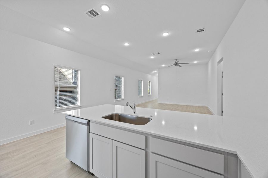 Kitchen in the Pecan II home plan by Trophy Signature Homes – REPRESENTATIVE PHOTO