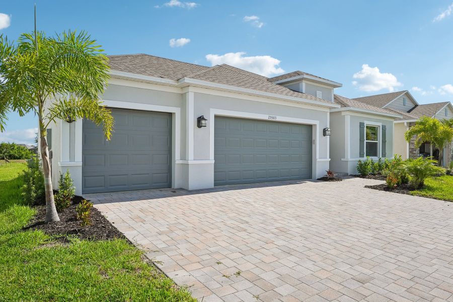 Front exterior of a new home in Heritage Station, Punta Gorda, FL, highlighting curb appeal (Image 28).
