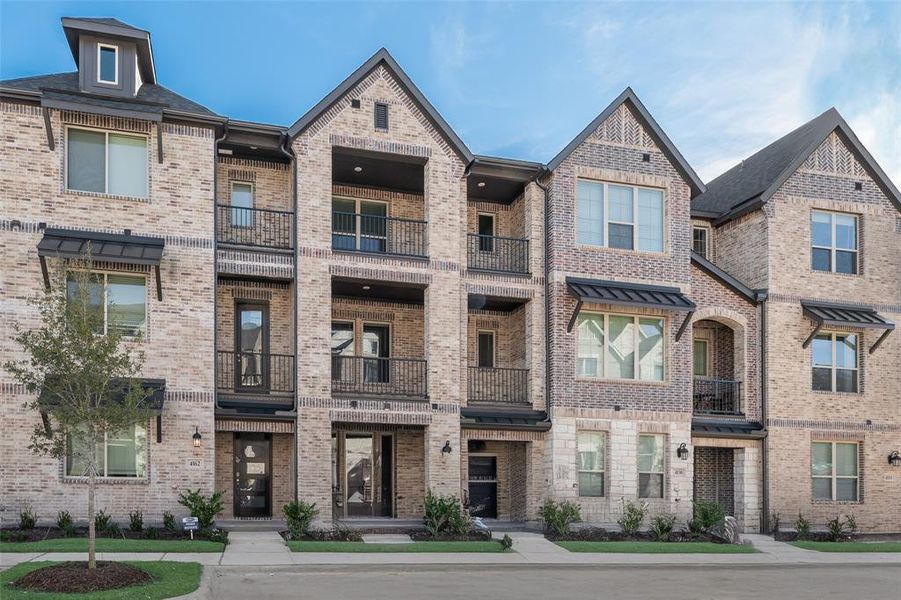 Front exterior of a new home in Wade Settlement Townhomes, Frisco, TX, highlighting curb appeal (Image 21).