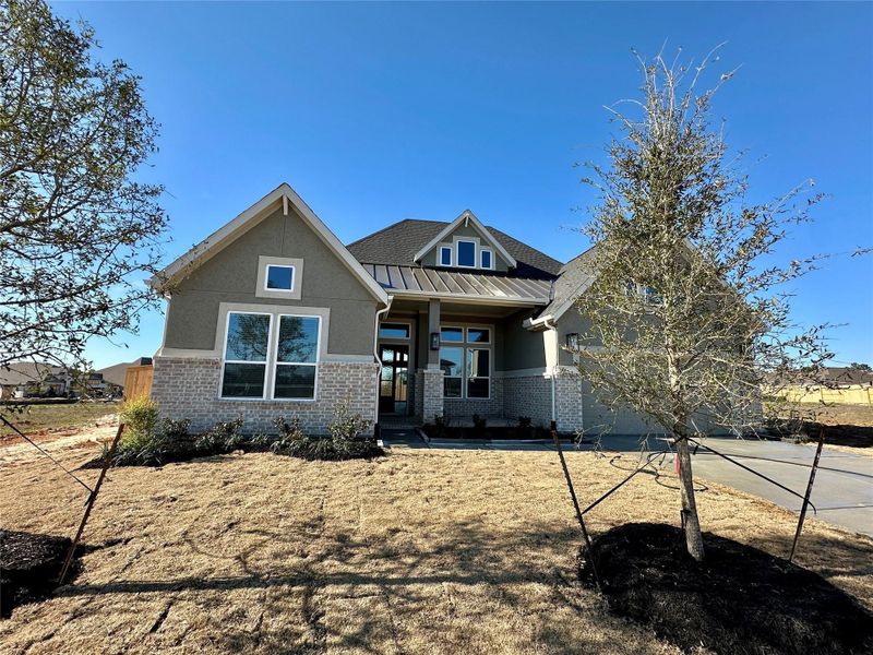Front exterior of a new home in Briarley, Montgomery, TX, highlighting curb appeal (Image 24).