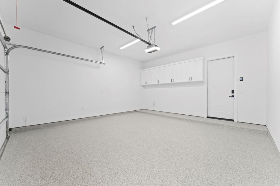 custom cabinets built in garage for extra storage w sink option.