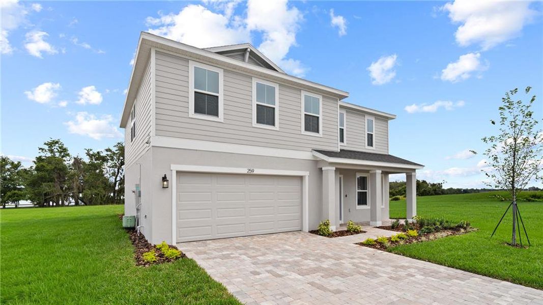 Front exterior of a new home in Willowbrook North, Winter Haven, FL, highlighting curb appeal (Image 26).