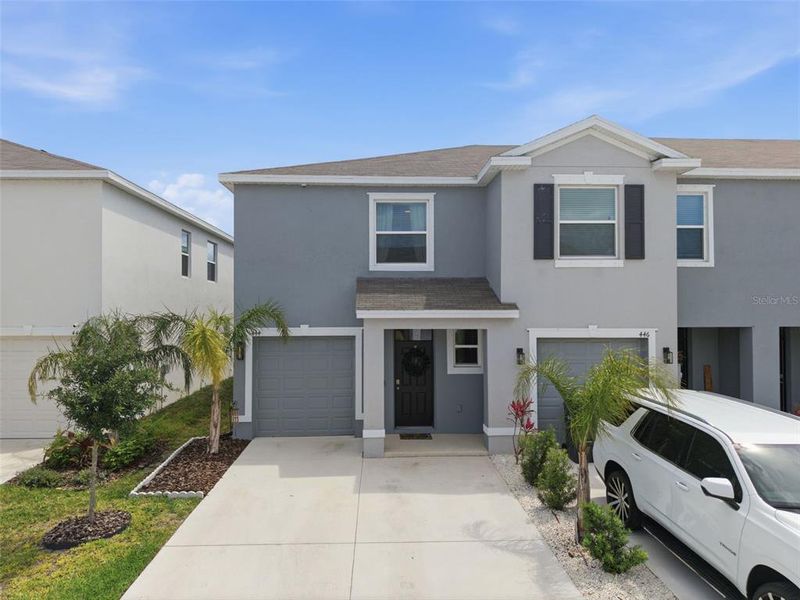 Front exterior of a new home in , Apollo Beach, FL, highlighting curb appeal (Image 20).