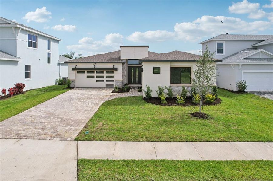 Front exterior of a new home in Biscayne Landing at Seaire, Parrish, FL, highlighting curb appeal (Image 22).