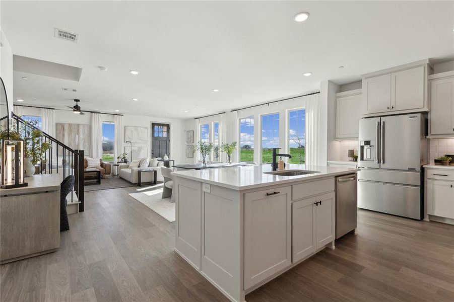 The chef will never be left out of the party in this fantastic home!
