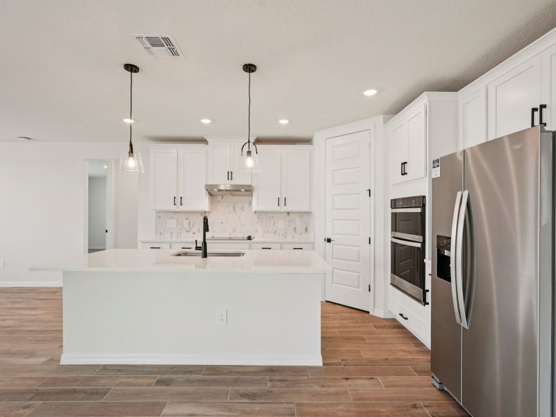 Furnished interior view inside a new home in Oakfield Trails - Signature Series, Parrish (Image 6). Furnished interior view inside a new home in Oakfield Trails - Signature Series, Parrish (Image 6).
