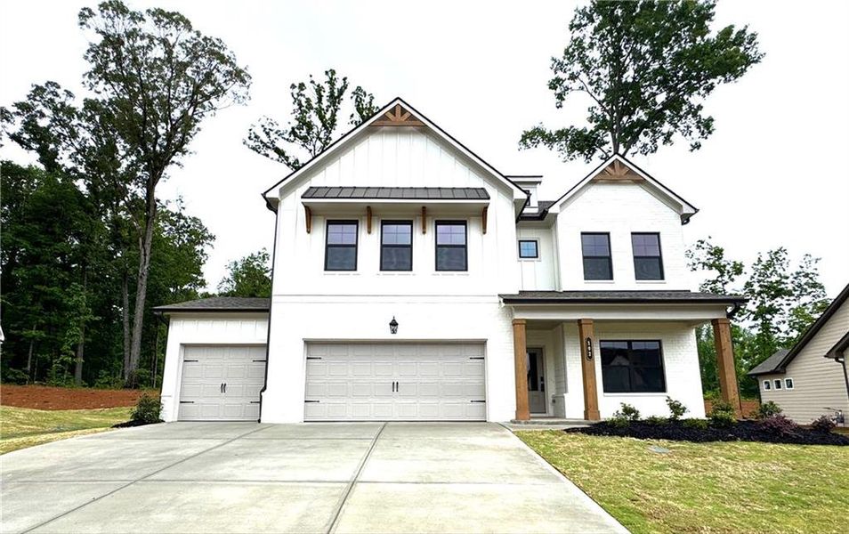 Front exterior of a new home in Rosewood Lake Preserve, Hoschton, GA, highlighting curb appeal (Image 2). Front exterior of a new home in Rosewood Lake Preserve, Hoschton, GA, highlighting curb appeal (Image 2).