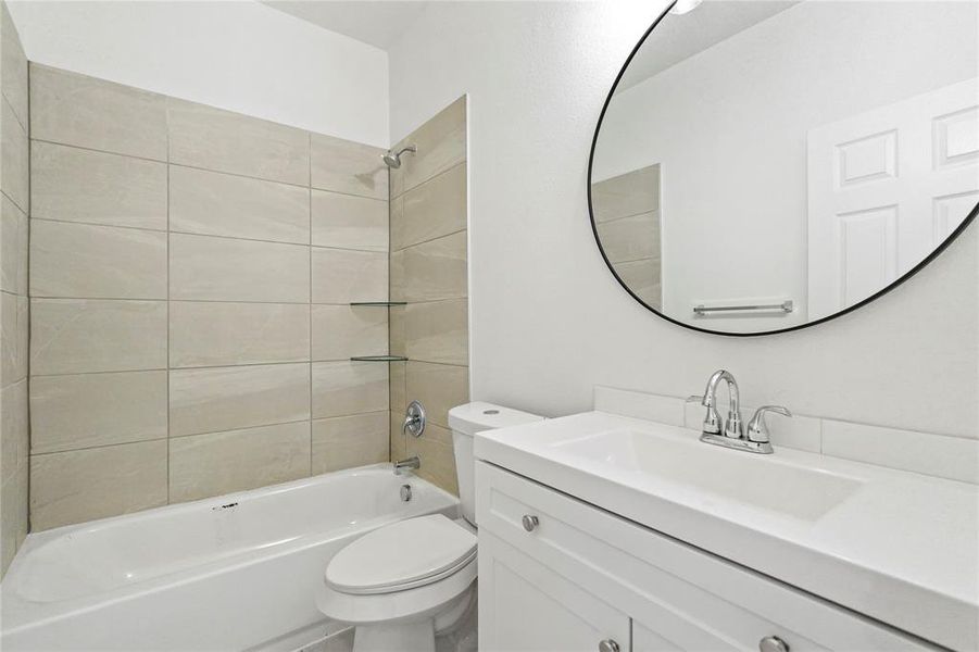 Full bathroom featuring shower / bath combination and vanity