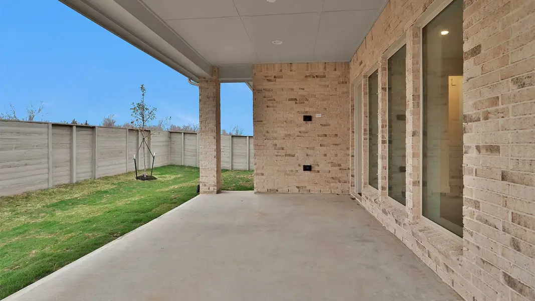 Exterior details and patio area of a home in Legacy 50', League City (Image 4).