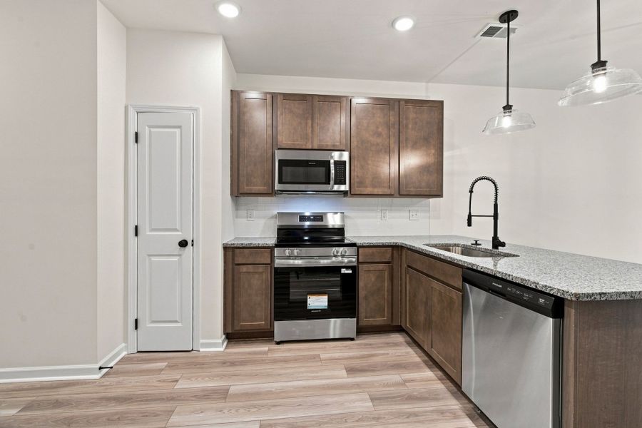 These pictures are of another unit of the same floor plan. Design selections will vary.