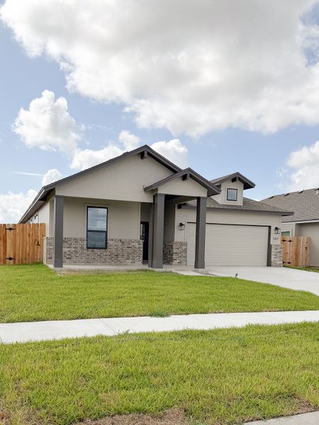 Front exterior of a new home in TerraVista, Victoria, TX, highlighting curb appeal (Image 28).