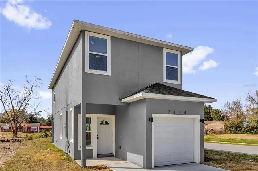 Front exterior of a new home in , Sanford, FL, highlighting curb appeal (Image 2). Front exterior of a new home in , Sanford, FL, highlighting curb appeal (Image 2).