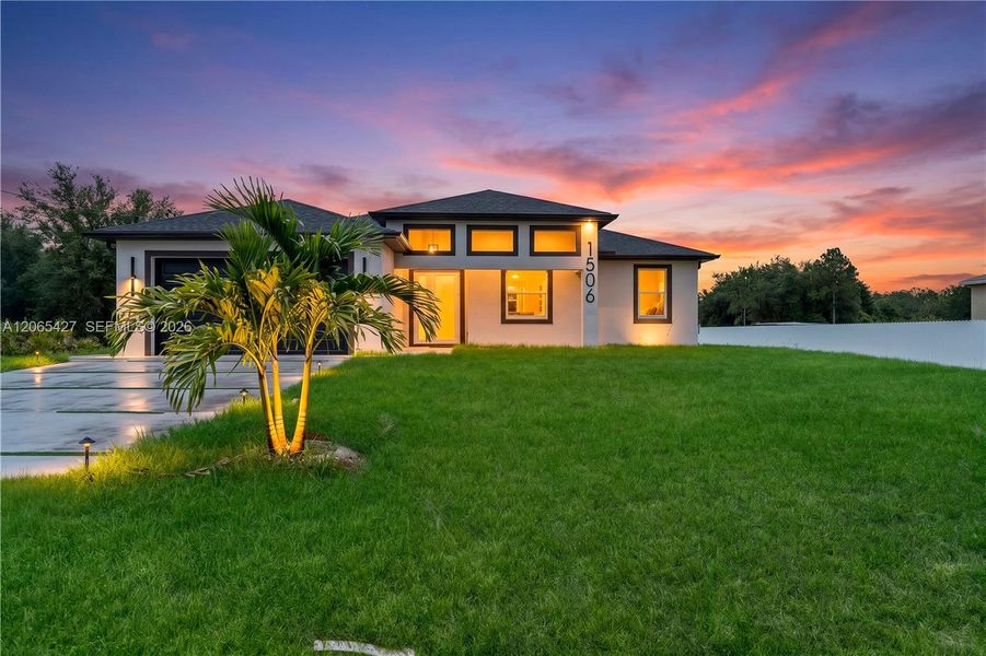 Front exterior of a new home in , Lehigh Acres, FL, highlighting curb appeal (Image 18). Front exterior of a new home in , Lehigh Acres, FL, highlighting curb appeal (Image 18).