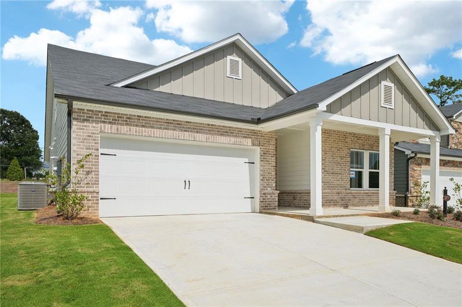 Front exterior of a new home in Martin Springs - Estate Series, Lawrenceville, GA, highlighting curb appeal (Image 23). Front exterior of a new home in Martin Springs - Estate Series, Lawrenceville, GA, highlighting curb appeal (Image 23).