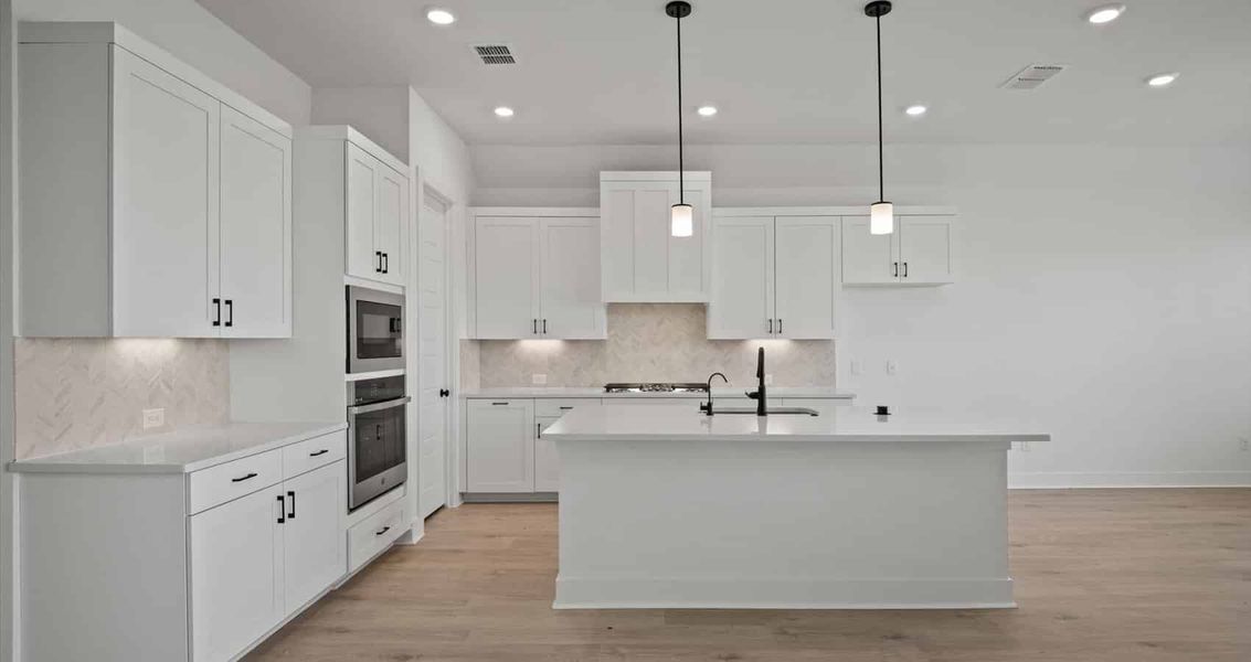 Furnished interior view inside a new home in Village at Three Oaks, Seguin (Image 5).