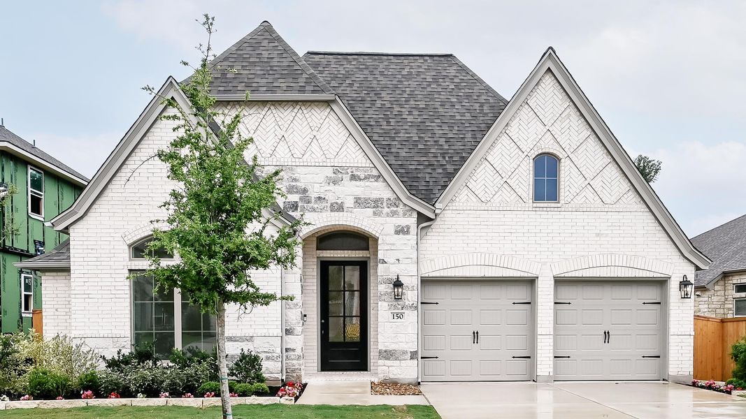 Front exterior of a new home in 6 Creeks, Kyle, TX, highlighting curb appeal (Image 1). Front exterior of a new home in 6 Creeks, Kyle, TX, highlighting curb appeal (Image 1).