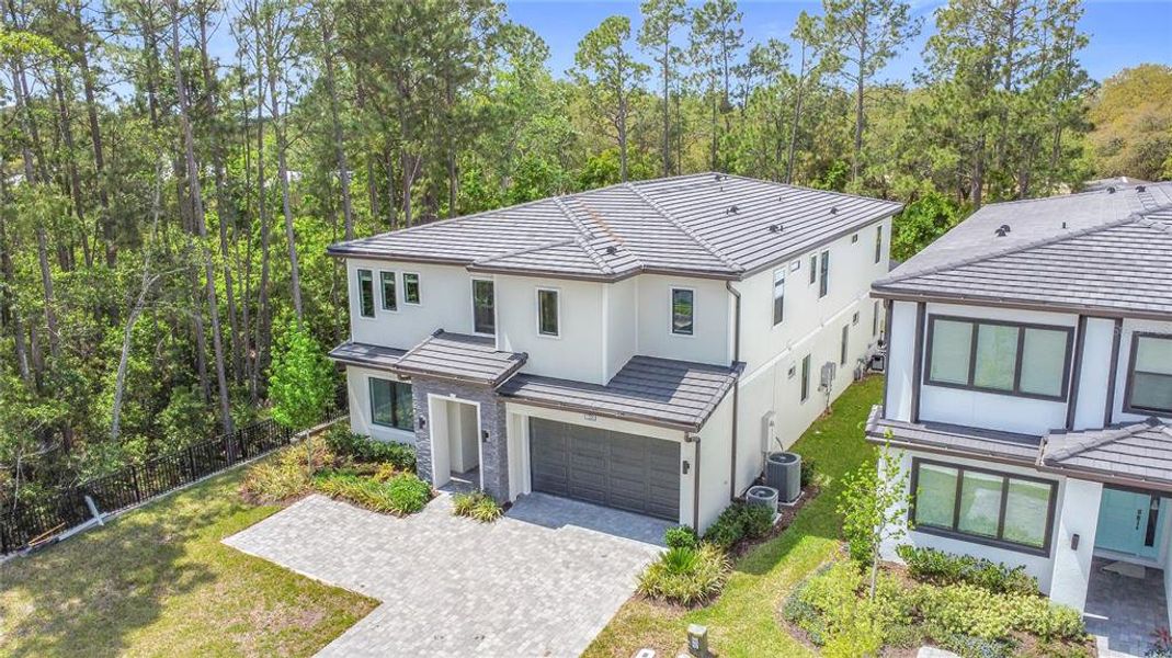 Front exterior of a new home in , Davenport, FL, highlighting curb appeal (Image 2).