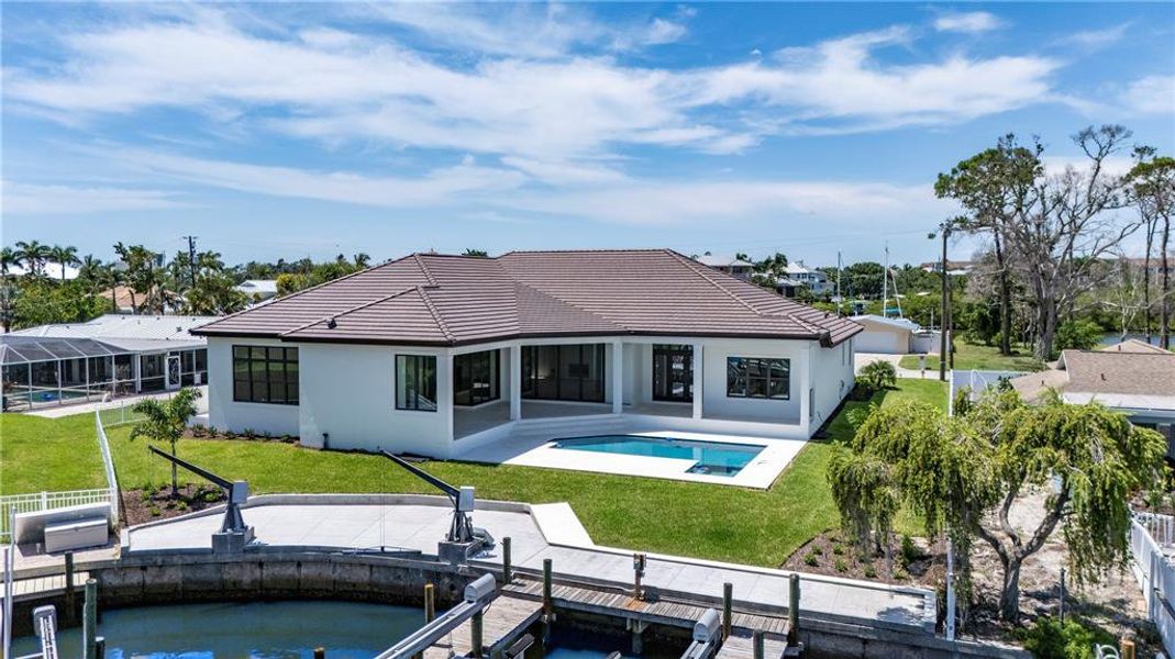 Front exterior of a new home in , Sarasota, FL, highlighting curb appeal (Image 14).