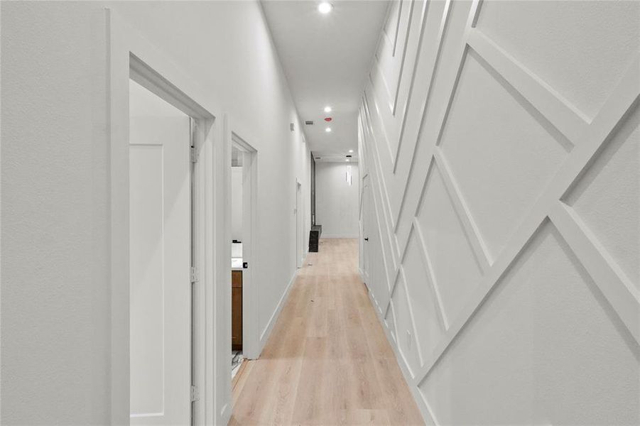 Corridor with light wood-type flooring