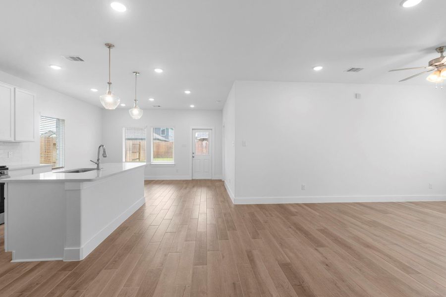 The gourmet kitchen features a massive eat in working station island with beautiful quartz countertops!  Hey —don’t miss out, schedule your showing today!