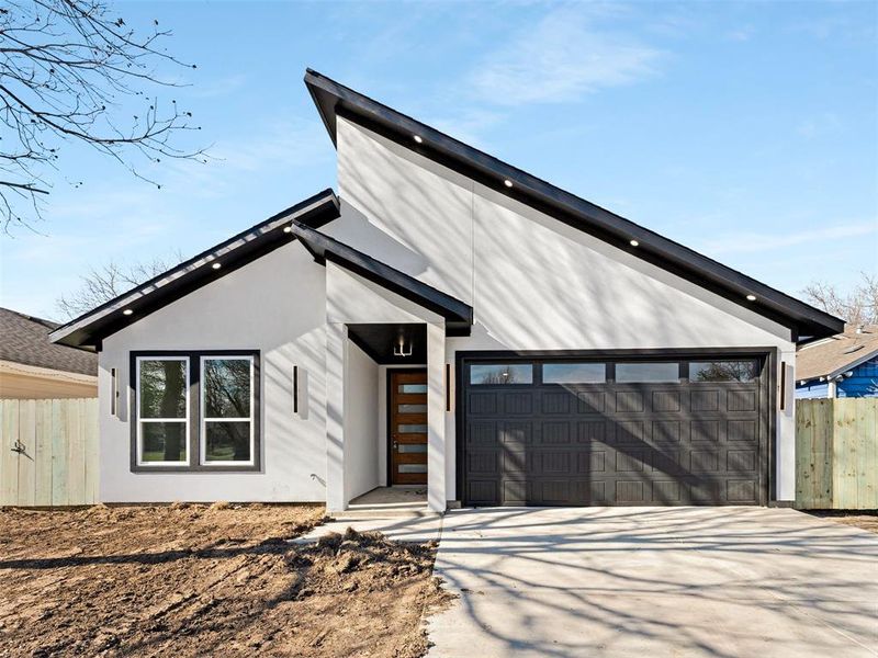 View of front of house with a garage