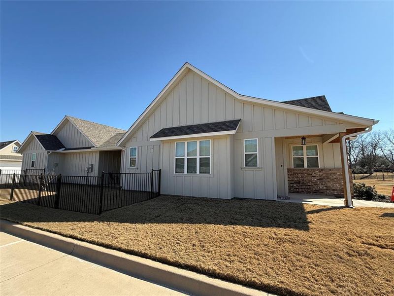 Front exterior of a new home in , Granbury, TX, highlighting curb appeal (Image 22). Front exterior of a new home in , Granbury, TX, highlighting curb appeal (Image 22).