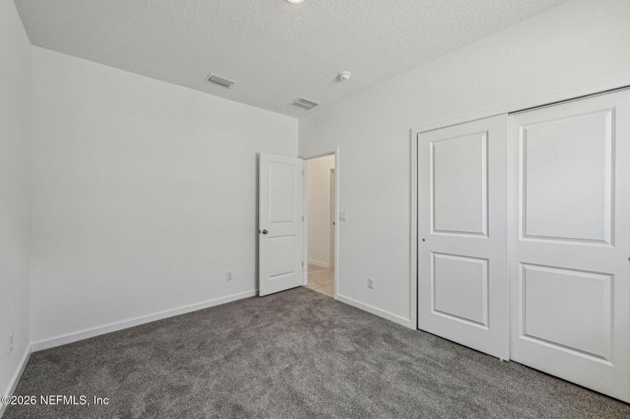 Spacious, unfurnished interior of a new home in Lakes at Bella Lago - Signature Series, Green Cove Springs (Image 28).