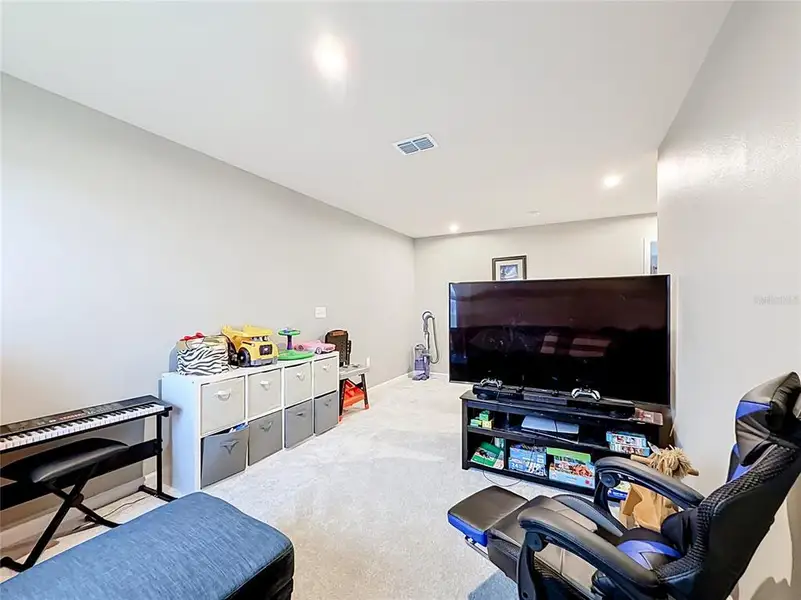 Furnished interior view inside a new home in , Sumterville (Image 10).
