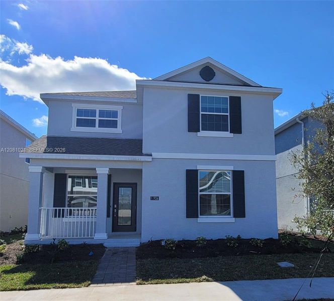 Front exterior of a new home in , Orlando, FL, highlighting curb appeal (Image 21).