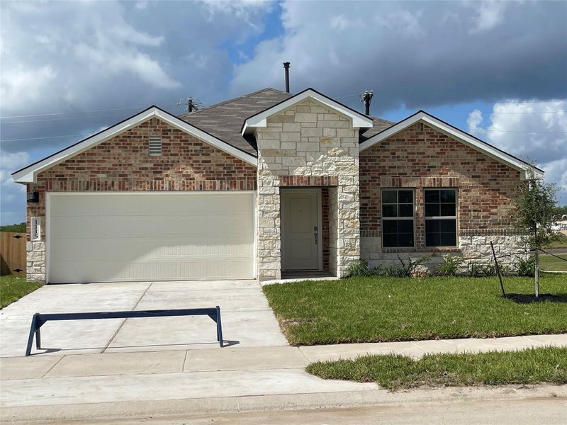 Front exterior of a new home in Liberty Village, Brenham, TX, highlighting curb appeal (Image 1). Front exterior of a new home in Liberty Village, Brenham, TX, highlighting curb appeal (Image 1).