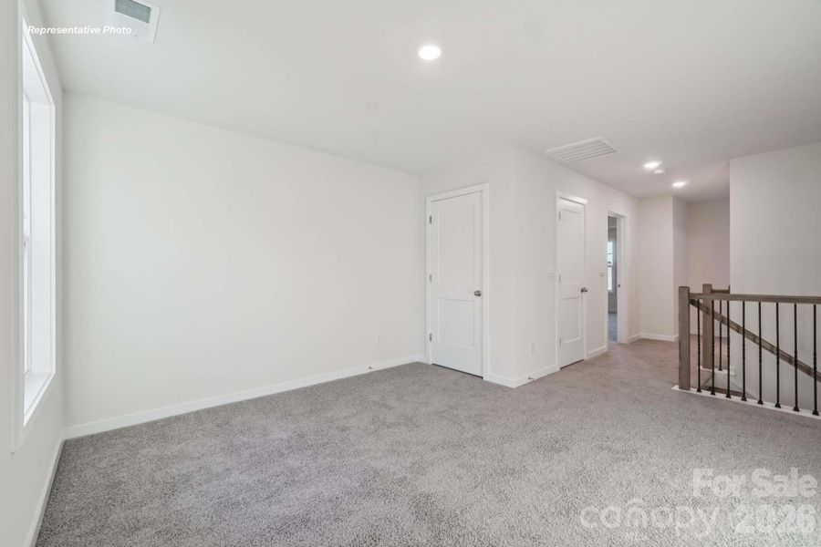 Spacious, unfurnished interior of a new home in Sanctuary at Southgate, Indian Trail (Image 18).