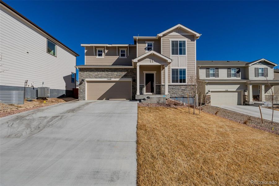 Front exterior of a new home in , Peyton, CO, highlighting curb appeal (Image 24).