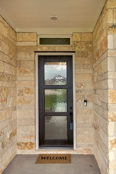 Exterior details and patio area of a home in Double Eagle Ranch, Cedar Creek (Image 3).