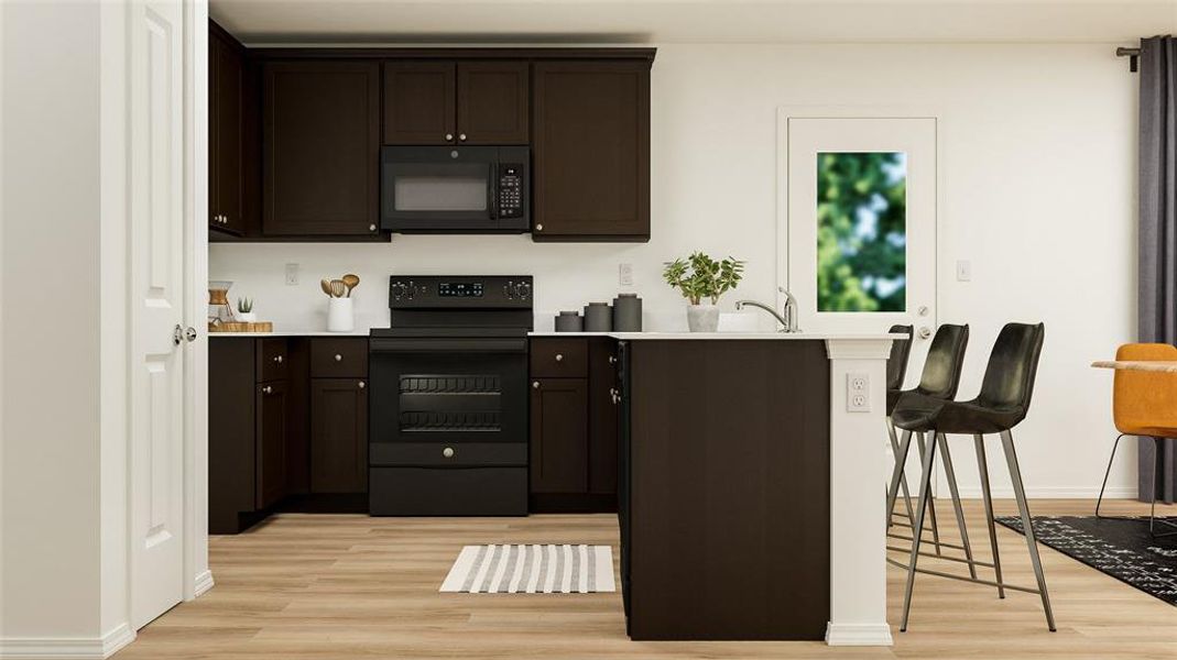 Kitchen featuring sink, dark brown cabinets, black appliances, and light wood-type flooring