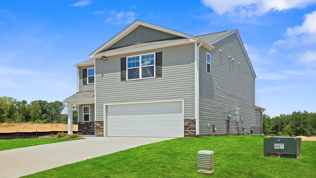 Front exterior of a new home in Harrier Point, Woodruff, SC, highlighting curb appeal (Image 2). Front exterior of a new home in Harrier Point, Woodruff, SC, highlighting curb appeal (Image 2).