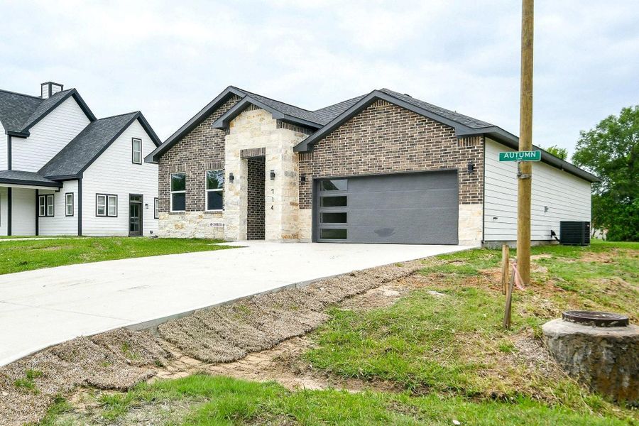 Front exterior of a new home in , Livingston, TX, highlighting curb appeal (Image 2).